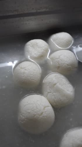 Rasgulla soaking in syrup